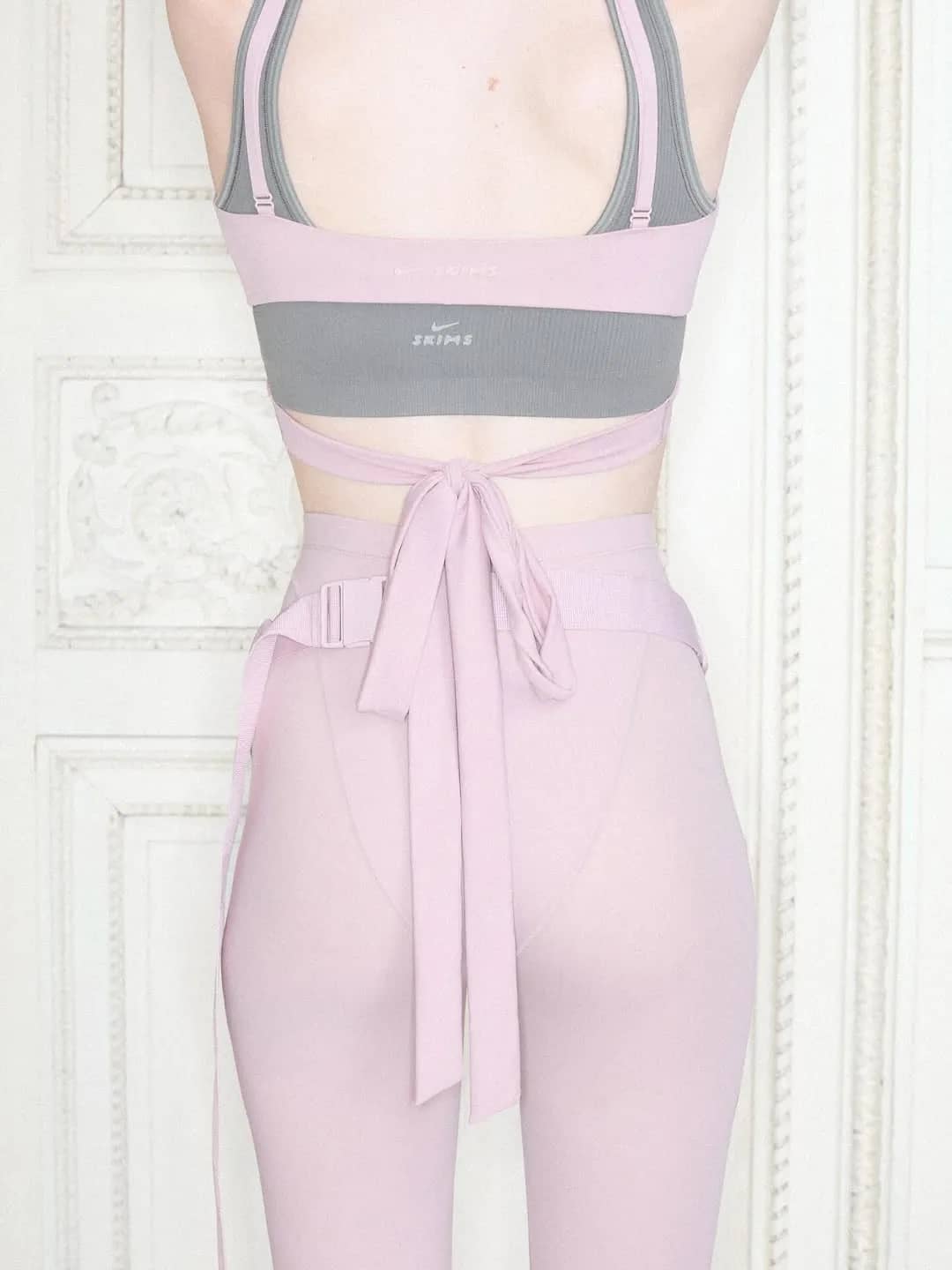 SKIMS Frames Nike Performance Through Romantic Bow and Wrap Details - Image 1