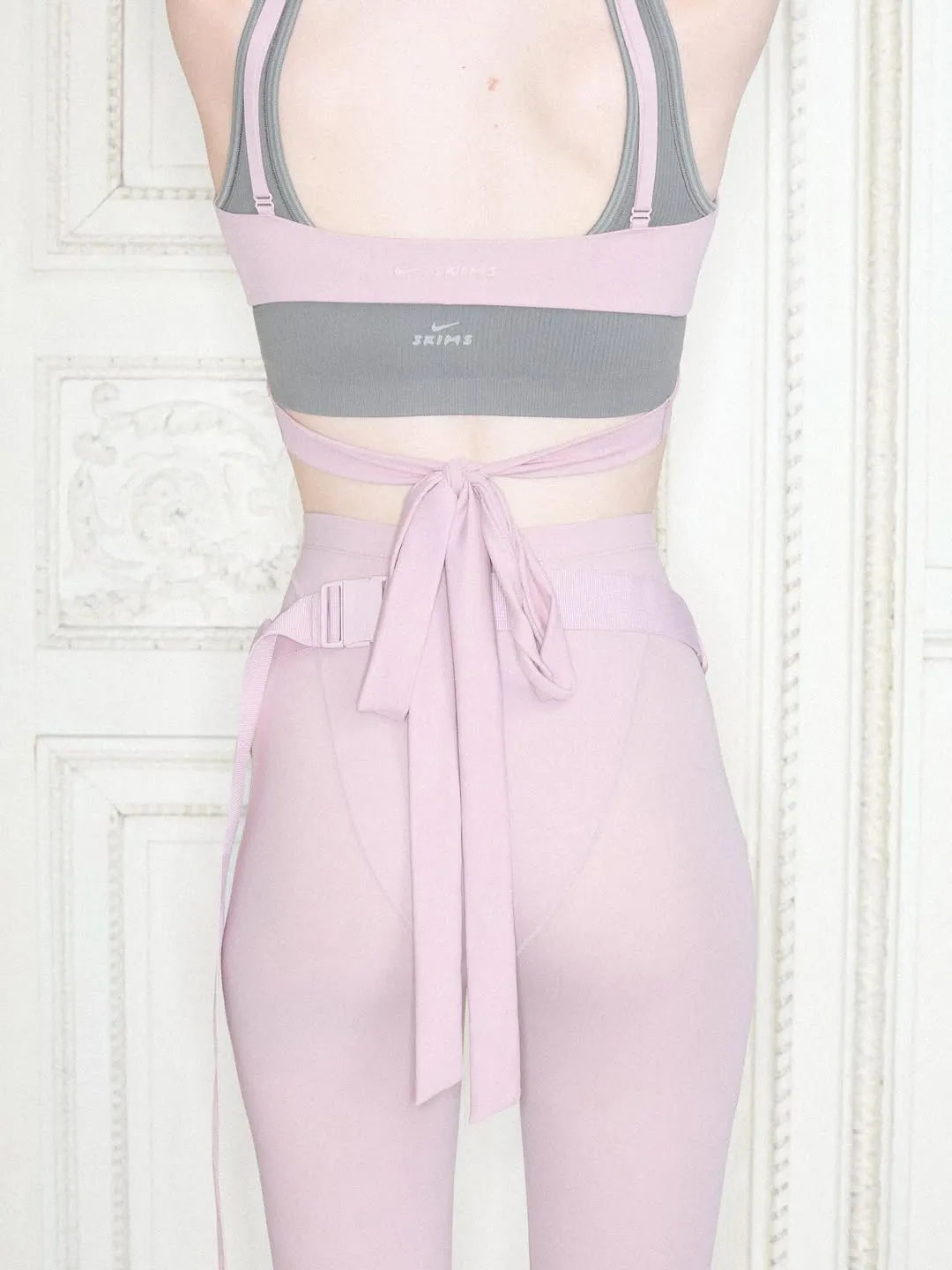 Nike Tech Joins the Coquette Aesthetic via SKIMS Bow Detailing - Image 1